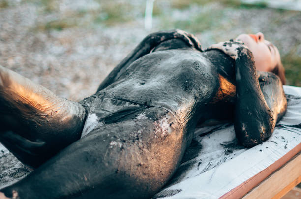 woman doing a mud bath at the spa