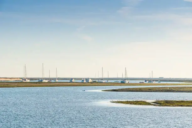 Photo of Sailboats and yachts docking on Ria Formosa wetlands in Faro, Algarve, Portugal