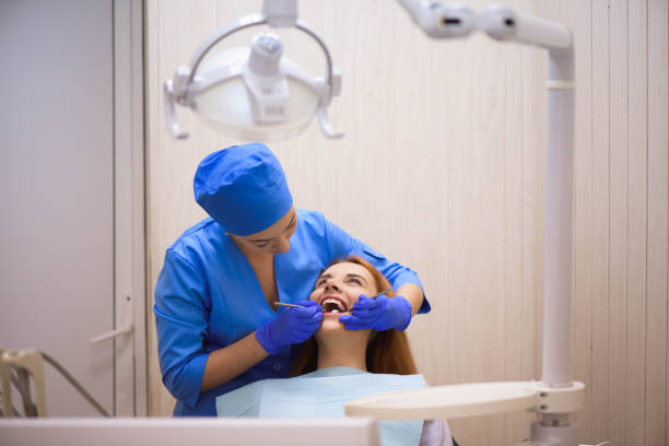 istock Dentist examining a patient's teeth in the dentist. 1311312261