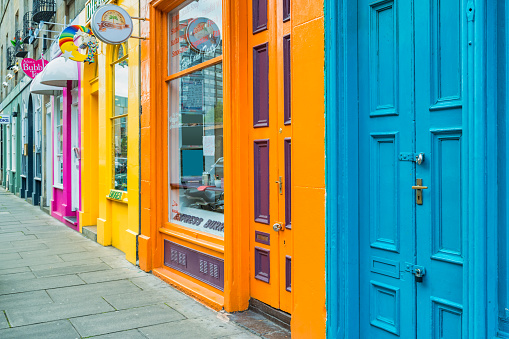 Colorful stores in downtown Edinburgh Scotland