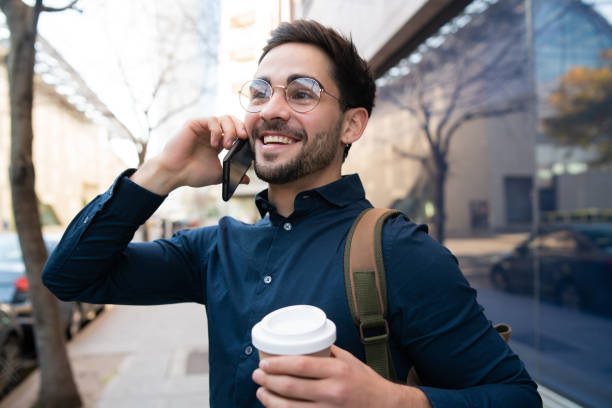 istock Young man talking on the phone outdoors. 1311315092