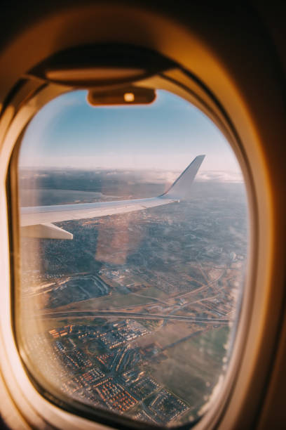 istock Airplane interior with window view over clouds. Concept of travelling. 1311315391