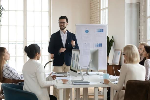 istock Young Caucasian businessman present project on whiteboard 1311315525