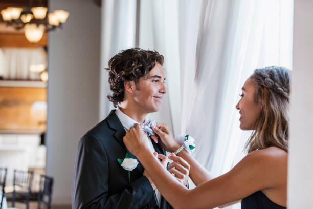 Teenage couple dressed for prom
