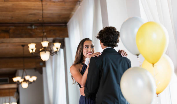 istock Teenage couple dressed for prom, slow dancing 1311316708