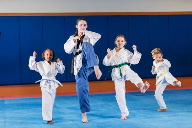 istock Teacher and children in taekwondo class 1311316917