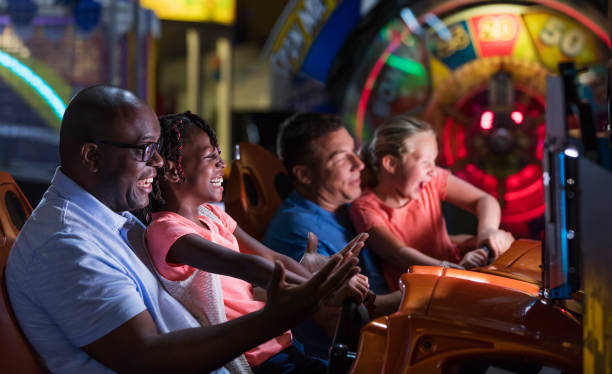 istock Two families playing an arcade game 1311317438