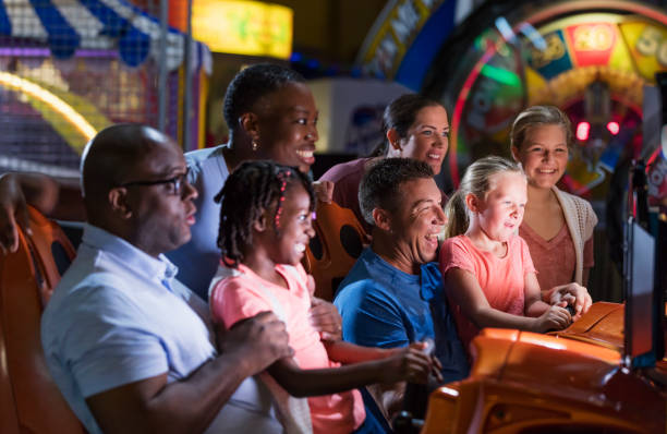 istock Two families playing an arcade game 1311317459