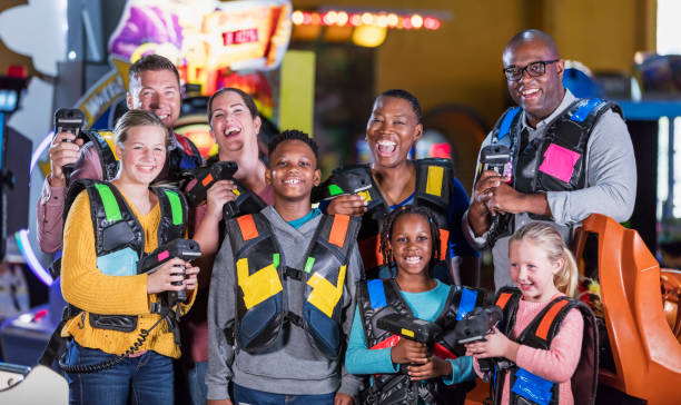 istock Two families ready to play laser tag 1311318043