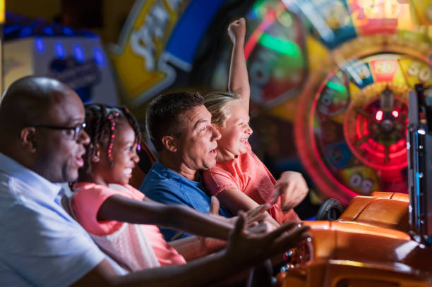 istock Two families playing an arcade game 1311318072