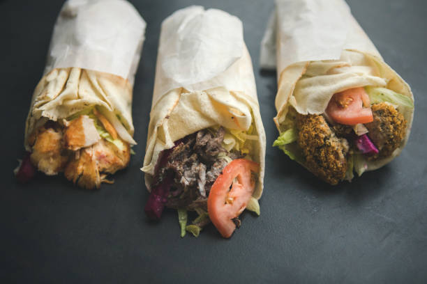 Tawook Chicken, Shawarma And Falafel Pita Sandwich, Middle Eastern Street Food Middle eastern style street food: grilled chicken, shawarma and falafel pita wrap sandwich shawarma stock pictures, royalty-free photos & images