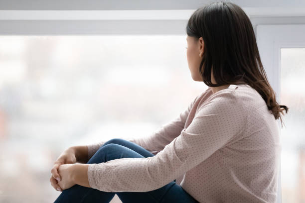 istock Upset young woman look in distance missing thinking 1311319797