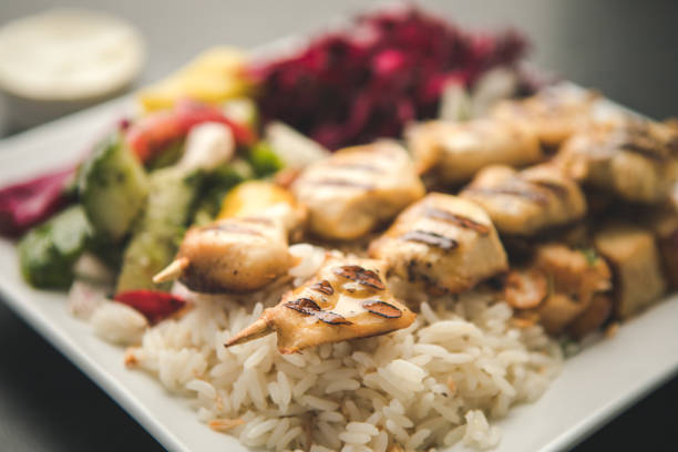 Delicious middle eastern cuisine, chicken skewer with rice and veggies