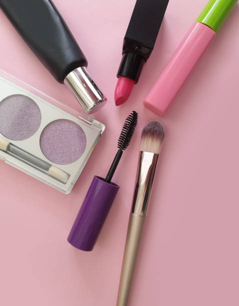 istock decorative cosmetics, mascara, lipstick, cream on a colored background 1311322635