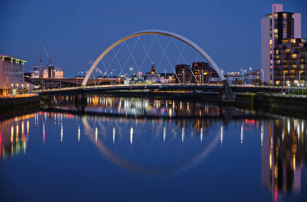 Night view of the Clyde Arc or Squinty Bridge from the East and river Clyde Night view of the Clyde Arc or Squinty Bridge from the East and river Clyde, Glasgow, Scotland glasgow scotland stock pictures, royalty-free photos & images