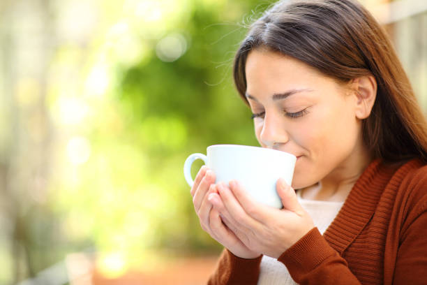 istock Relaxed woman drinking coffee in a garden 1311322706