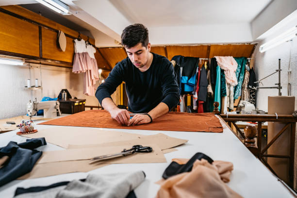 istock Fashion designer working in atelier 1311325370