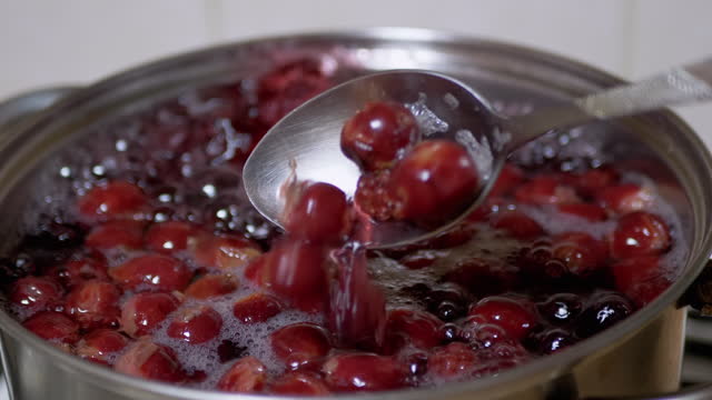 Cooking Compote, Punch from Frozen Cherries, Blackberries in Home Kitchen. Zoom
