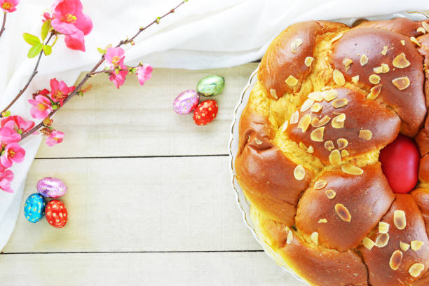 istock Easter bread ,mini chocolate eggs and  flowering quince 1311326398