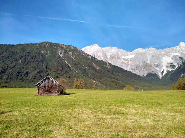 istock alpine panorama view with idyllic little hut 1311327935