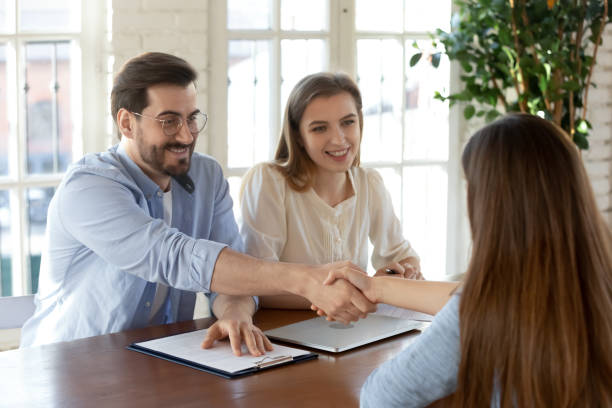 istock Smiling male employer handshake candidate at interview 1311330652