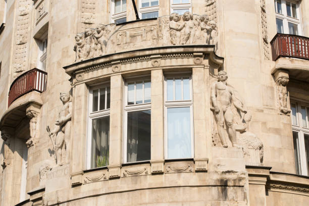 istock Element of an old building with a window and balconies 1311331532