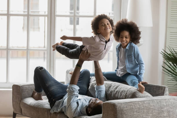 istock African American father playing funny active sport games 1311335788
