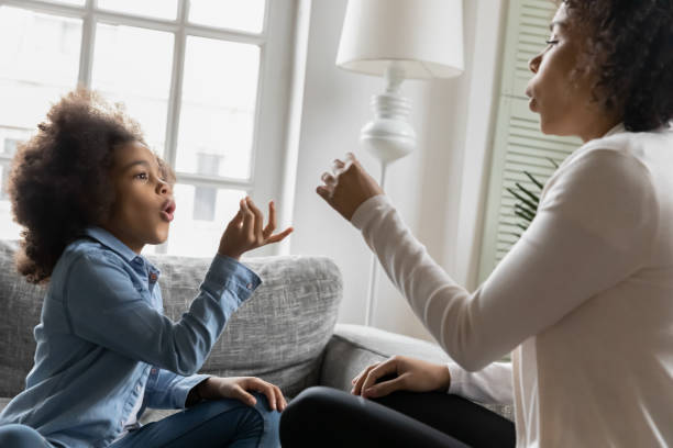 istock Excited African American kid talking to mom nonverbal 1311335790