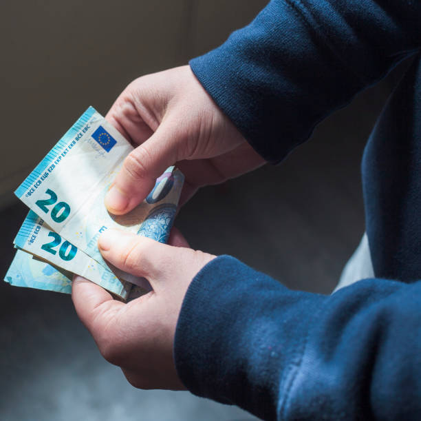 istock Businessman counting money 1311336875