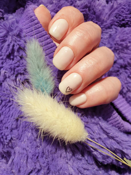 istock female hand beautiful beige manicure 1311337186