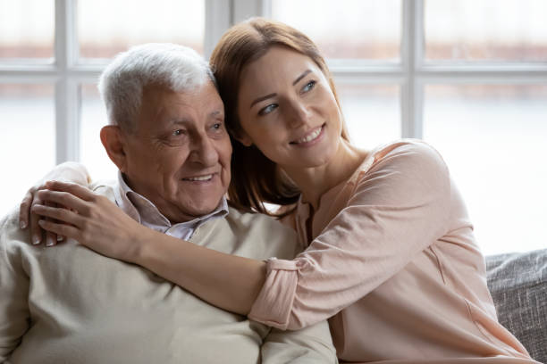 istock Affectionate grownup daughter embrace retired dad sharing optimism positive emotions 1311337340