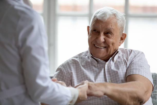 istock Doctor support encourage retired older man patient holding his palms 1311337373
