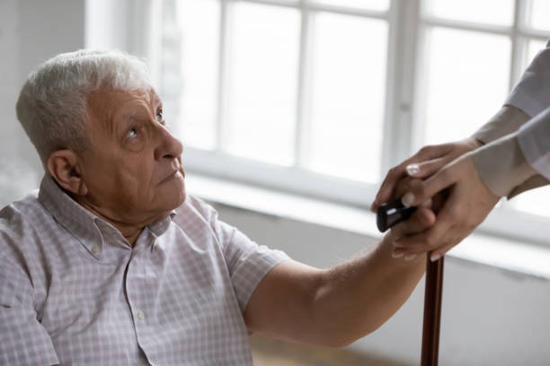 istock Disabled elderly male receive help compassion from retreat center staff 1311337376
