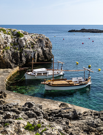 Llauts moored in a harbor. Binibeca.