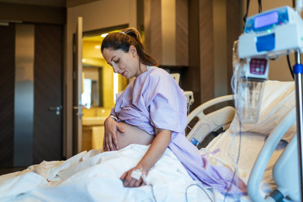 Young pregnant woman in the hospital ward and ready to delivery a baby. Young pregnant woman in the hospital ward and ready to delivery a baby. miscarriage stock pictures, royalty-free photos & images