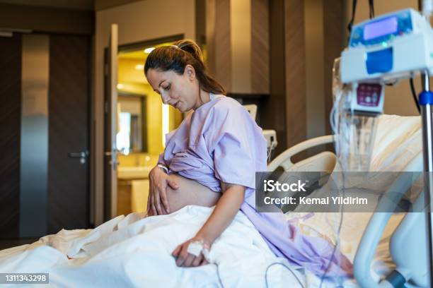 Young Pregnant Woman In The Hospital Ward And Ready To Delivery A Baby Stock Photo - Download Image Now
