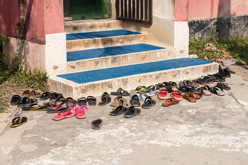 Shoes in front of Abdul Hamid Mosque in Sonargaon town, Bangladesh