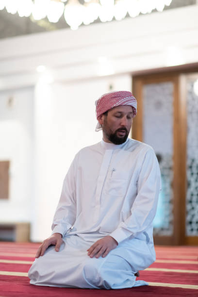 istock a Muslim ends a prayer by turning his head to the side,. 1311345063