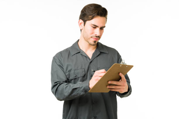 Repairman writing and ready to start working