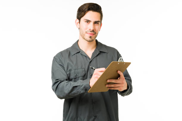 istock Young repairman checking his tasks on a clipboard 1311346389