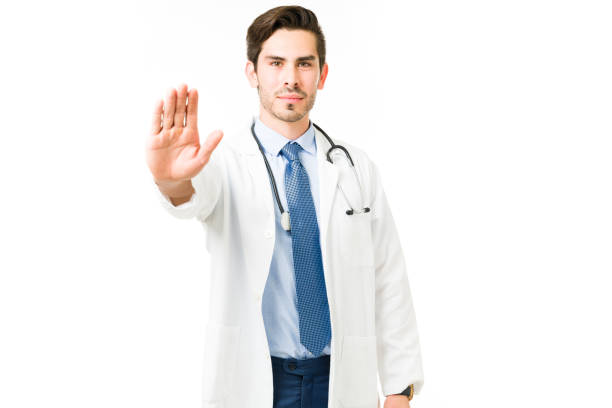 istock Professional doctor holding up his hand and stopping 1311346443