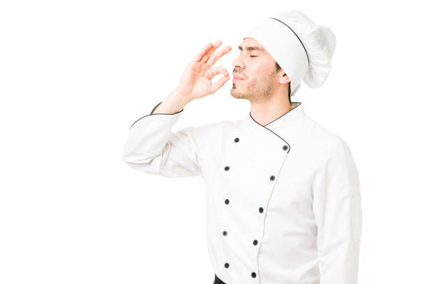 istock Successful chef finishing a delicious menu at a restaurant 1311346568