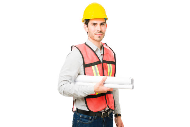 istock Attractive civil engineer standing in front of a white background 1311346692