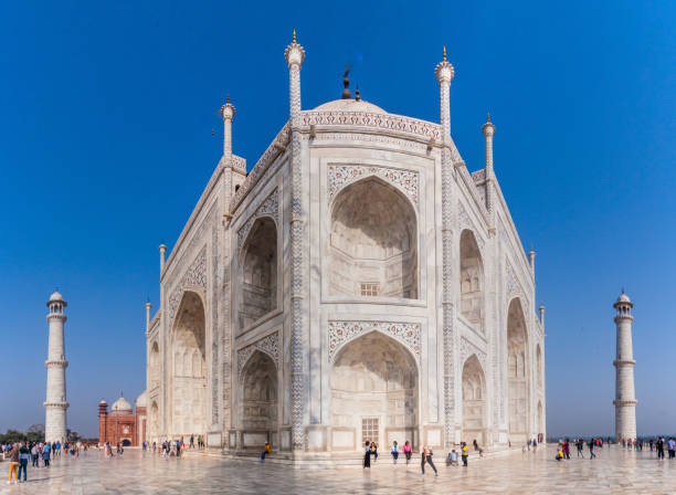 AGRA, INDIA - FEBRUARY 19, 2017: Tourists visit Taj Mahal complex in Agra, India