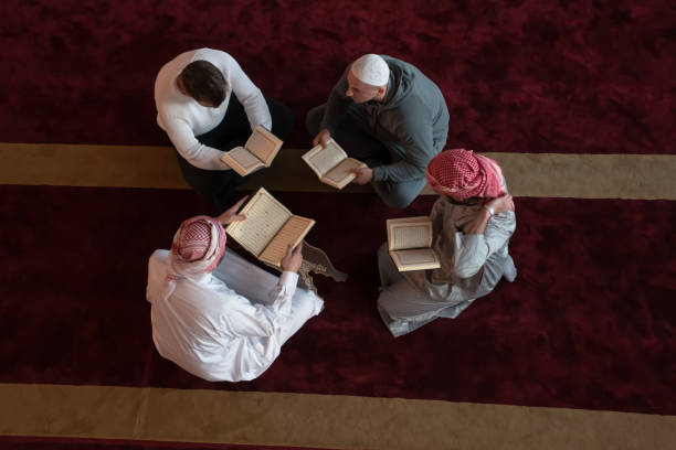 istock muslim people in mosque reading quran together 1311348050