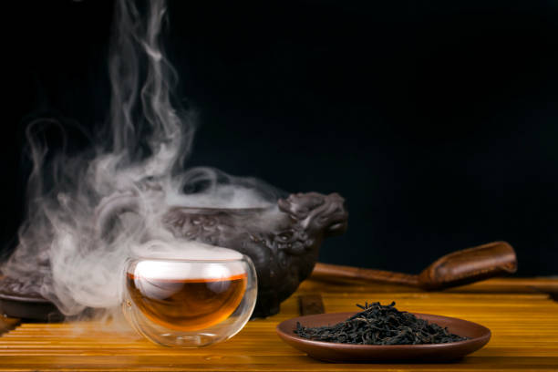 istock Clay teapot with smoked red tea Lapsang souchong 1311348333