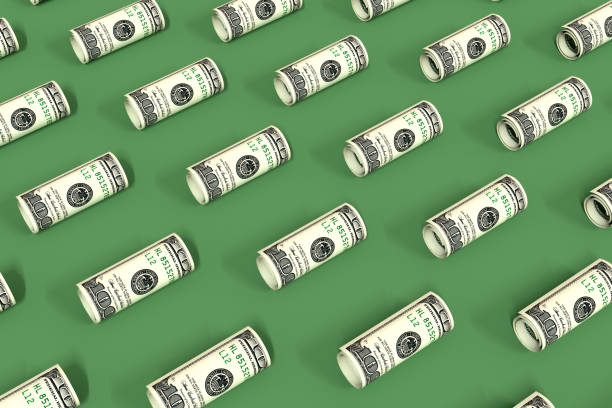 Rolled up dollar bills lie on a green surface. Creative money pattern. 3d illustration.