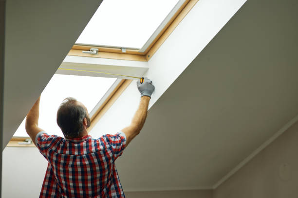 istock For a better view. Rear view of handyman using measure tape while measuring a window in a new dry wall attic 1311350179