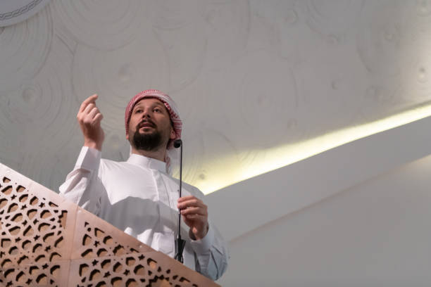 istock Muslims young arabic Imam has a speech on friday afternoon prayer in mosque. 1311350769