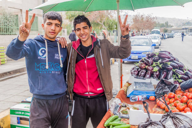 Ramallah, Palestine, January 12, 2011: A man selling fresh fruits and vegetable on a market in the centre of Ramallah.